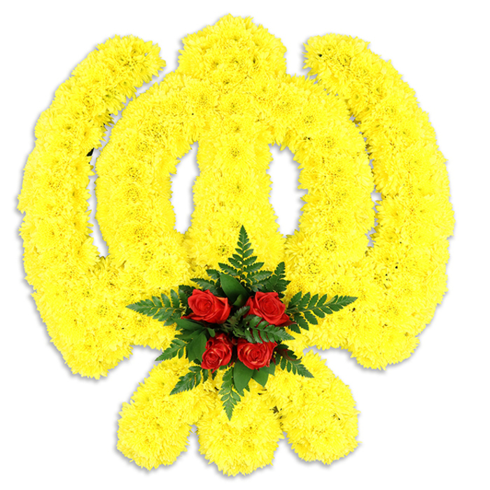 This meticulously crafted floral Khanda is presented like a luminous emblem on white studio paper: every element of the Sikh symbol - the central double-edged khanda, the encircling chakram and the two crossed kirpans - is precisely traced in a blanket of tiny, bright yellow chrysanthemum blooms. The chrysanthemums are densely placed to form smooth, curving edges and subtle relief, their layered petals creating a soft, almost plush surface that reflects light in warm, golden tones. At the very centre, five rich red roses form a focused heart; their deep crimson faces and velvety textures are tucked into a neat bed of dark green fern leaves, whose feathery fronds produce a cooling contrast and frame the roses like a natural cushion. A faint grey shadow beneath the piece confirms its tangible scale - a ceremonial wreath or standing tribute suitable for use at memorials, Gurdwara services, or cultural commemorations. The scent is composed and comforting: the slightly sweet, honeyed note of chrysanthemums with the fuller, woody-rose perfume layered above, while the greenery adds a clean, earthy lift. As Florist Bellingham, serving the local community near Bellingham station and across Lewisham and Catford, we often prepare arrangements like this for families seeking a faithful and dignified floral expression; its careful workmanship and clear symbolism make it appropriate for services where tradition and heartfelt remembrance are paramount, delivered with sensitivity across the neighbourhood.